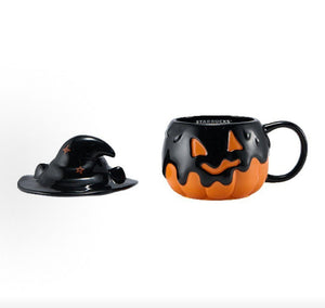 Starbucks halloween pumpkin cup with lid removed, side view