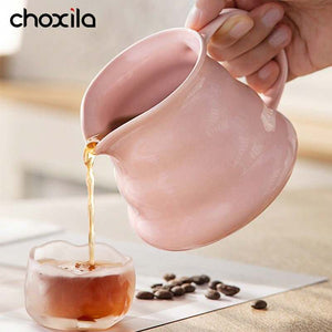 Choxila Origami Series ceramic coffee set with pink geometric dripper, matching server, and bamboo tray