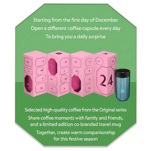 Nespresso advent calendar top angled view showing numbered compartments and travel cup