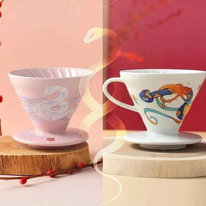 HARIO V60 2025 Lunar New Year Edition ceramic coffee dripper with celestial snake design in Blossom Pink and Imperial White colors