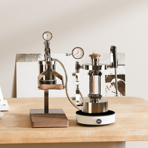 Aleman 2s Hand Press espresso machine with stainless steel body and wooden accents