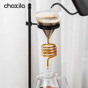 Choxila Snake Tube glass coffee dripper with amber spiral tube on wooden base for slow-drip pour-over brewing
