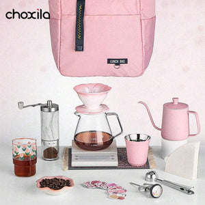 Blush Pink Travel Set with ceramic dripper, gooseneck kettle, marble grinder, insulated mug, and travel case