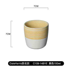 Handleless Modern Ceramic Espresso Cup with dual-texture finish in pastel celadon green by Loveramics