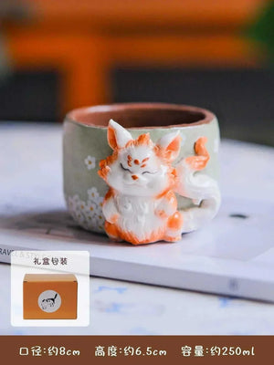 Set of 3D whimsical handcrafted ceramic cups from the Yifang Artisan Collection featuring playful characters and vibrant hand-painted details
