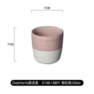 Modern ceramic handleless espresso cup with dual-textured finish and matte base by Loveramics