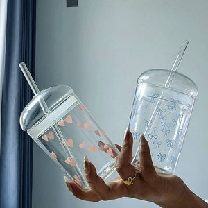 Household glass cup with heart and bow design and matching straw