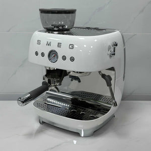 SMEG Espresso Coffee Machine with built-in grinder, 20 bar pressure, milk frother, and premium metal design