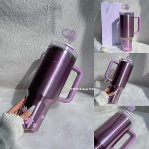 Starbucks cup from Purple Cherry Blossom Collection stainless steel drinkware with floral design and vacuum insulation