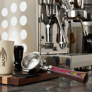 Bottomless espresso portafilter with a layered colored wood handle by IKAPE