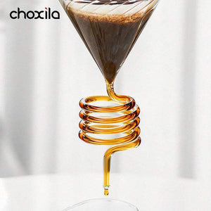 Choxila Snake Tube glass coffee dripper with amber spiral tube on wooden base and matte black metal stand for slow-drip pour-over brewing