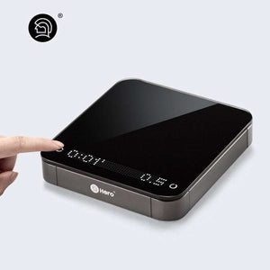 HARIO Smart Electronic Coffee Scale with dual LED display, polished glass surface, and rechargeable battery for precise brewing