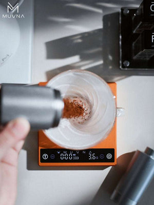 MUVNA ZERO-G PLUS smart digital coffee scale with high-precision sensors and aluminum alloy body in obsidian black and Hermès orange colors