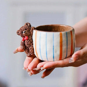 Hand-sculpted ceramic coffee cup from Yifang Coffee Cup Artisan Series with whimsical 3D details and textured finish