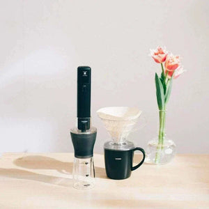 HARIO Smart G portable electric coffee grinder in matte black with dual transparent containers and one-touch operation