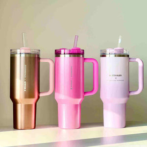 Starbucks Sakura collection featuring pink cherry blossom-themed ceramic mug and polka dot tumbler