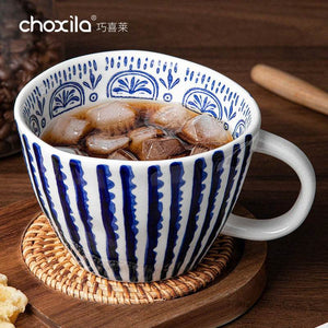 Choxila Hand-Painted Mug with blue and white ceramic design and ergonomic handle