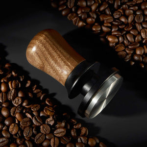Espresso tamper with natural wood handle and ripple stainless steel base for even coffee extraction