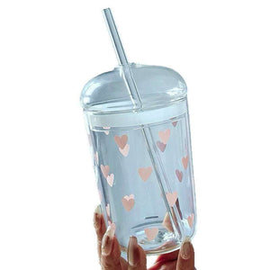 Household glass cup with heart and bow design and matching straw