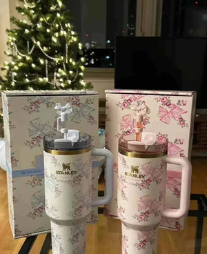 Stanley x LoveShackFancy 40oz Quencher H2.0 Tumbler with vintage floral design and ergonomic handle