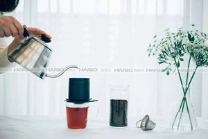 HARIO One-Cup Cafeor eco-friendly stainless steel mesh coffee filter on a mug brewing single cup coffee
