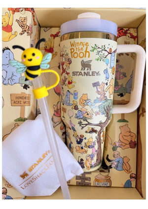 Stanley x Winnie the Pooh "Hundred Acre Wood" Edition tumbler with classic Pooh characters and gold accents