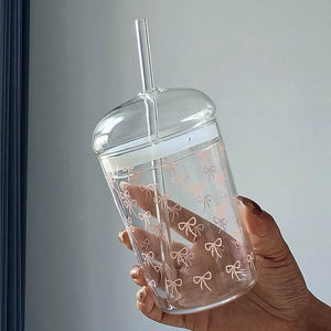 Household glass cup with heart and bow design and matching straw
