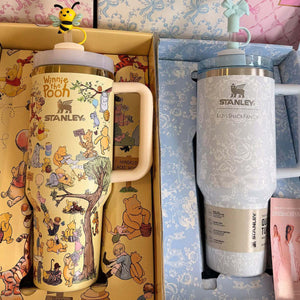 Stanley x Winnie the Pooh Hundred Acre Wood Edition tumbler with classic Pooh characters and gold accents