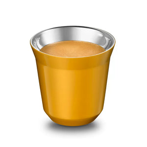 Yellow stainless steel espresso cup with coffee, angled view