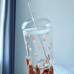 Household glass cup with heart and bow design and matching straw