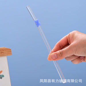 Transparent colored bear glass reusable straw with gummy bear charm in a cup