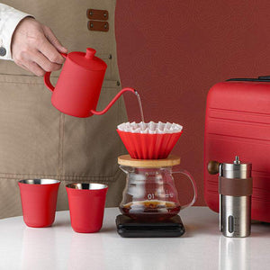 Choxila Red Edition professional travel coffee kit with matte crimson kettle, manual grinder, digital scale, red dripper, glass server, insulated mugs, and hard-shell case