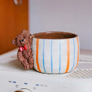 Hand-sculpted ceramic coffee cup from Yifang Coffee Cup Artisan Series with whimsical 3D details