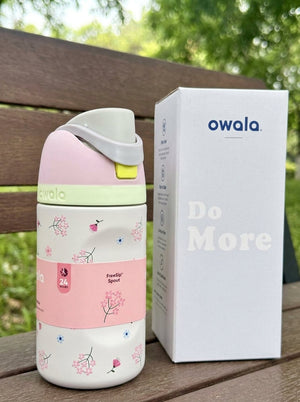 Floral stainless steel water bottle by Owala with a push-button lid