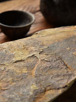 Stone tea tray with Buddha cave carving, close view