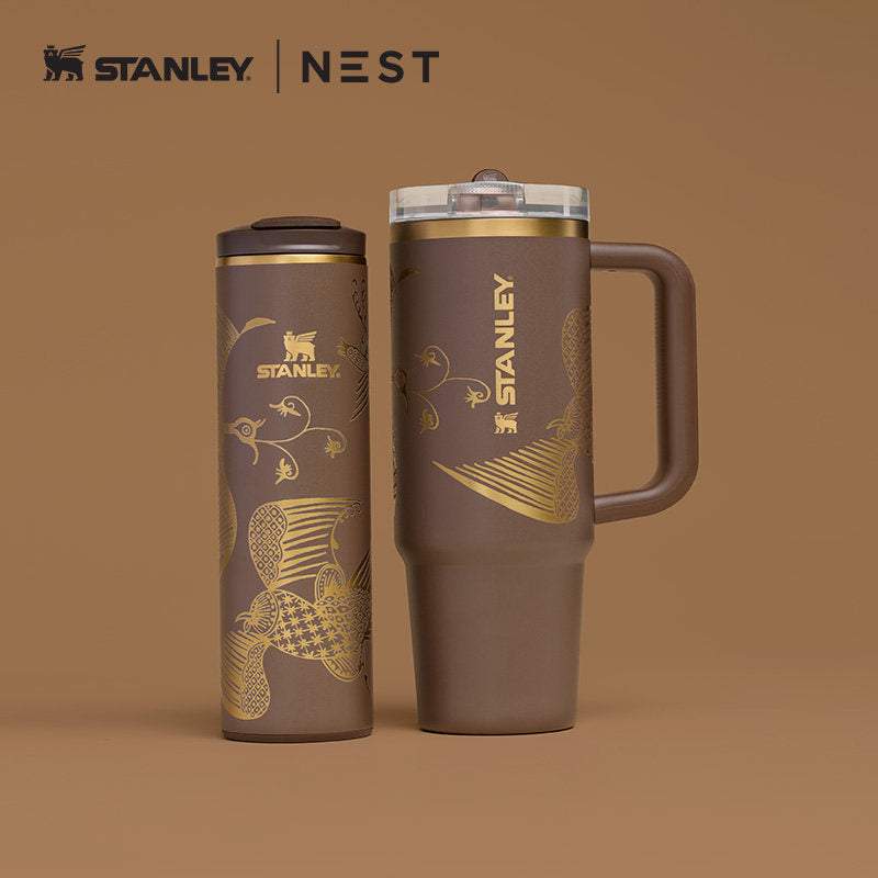 Stanley x NEST limited edition insulated travel bottles with artistic designs and dual-wall vacuum insulation