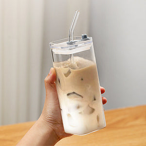 Square iced coffee glass cup with matching high-value glass straw on white background