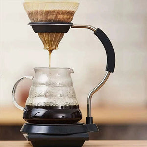 HARIO V60 Set with glass dripper, spiral carafe, stainless steel stand, and non-slip base for elegant pour-over coffee brewing