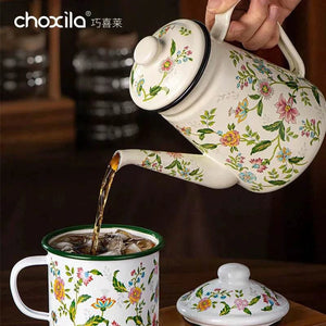 Choxila Floral Enamel Pot 1.2L ivory kettle with colorful vintage floral design and black rim on stovetop