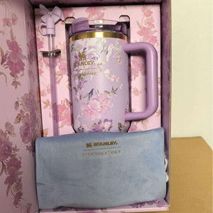 Stanley LoveShackFancy Quencher 40oz stainless steel thermos mug with double-wall insulation and FlowState lid for iced coffee