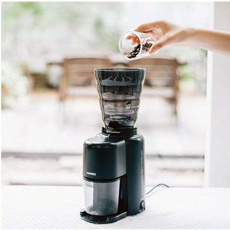 HARIO Japan Compact Electric Coffee Grinder EVC-8 with stainless steel conical burrs and 39 grind settings on a kitchen counter