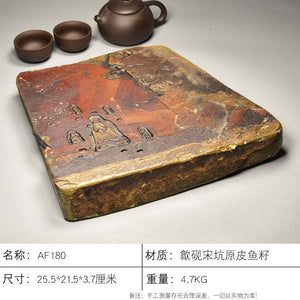 Handcrafted natural stone tea tray with intricate meditative carvings and rustic ochre tones for Gongfu tea ceremonies
