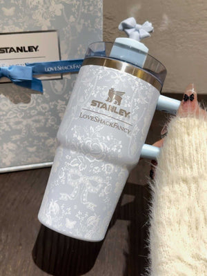 Stanley x Winnie the Pooh tumbler with Hundred Acre Wood vintage illustrations and gold accents in a collector’s gift set