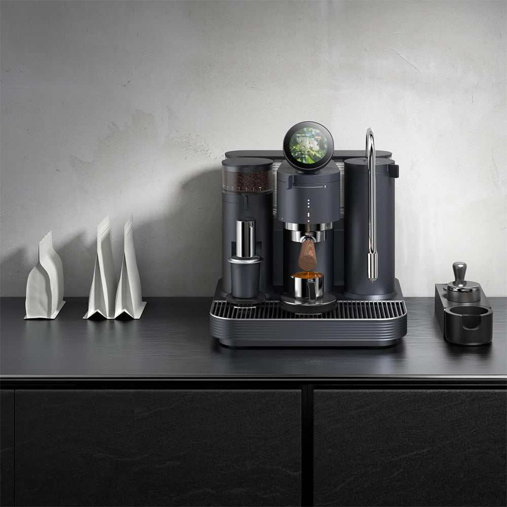 Meraki All-In-One Espresso Machine with walnut handle and smart touch display brewing espresso in modern kitchen