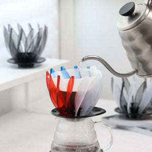 HARIO Water Lily V60 dripper with petal design and smoky transparent finish on black base