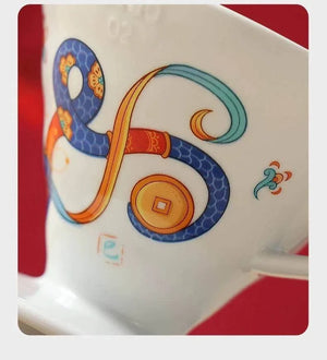HARIO V60 Lunar New Year Edition ceramic coffee dripper with Year of the Snake design in Blossom Pink and Imperial White colors