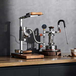 Aleman 2s Hand Press espresso machine with wooden base and stainless steel lever mechanism