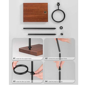 Choxila Snake Tube glass coffee dripper with amber spiral and matte black metal stand on wooden base