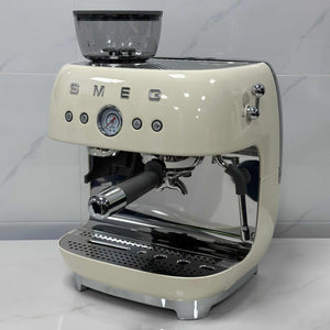 SMEG Espresso Coffee Machine with built-in grinder and milk frother in sleek metal design