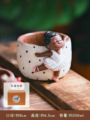 Hand-sculpted ceramic coffee cup from Artisan Series with whimsical 3D details and textured finish